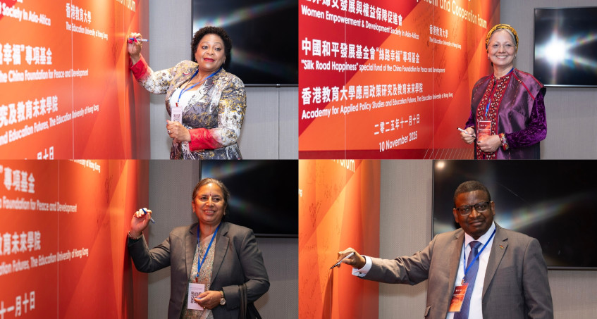 Government officials, ambassadors to China and representatives of international women’s organizations from Asia and Africa sign the guest wall